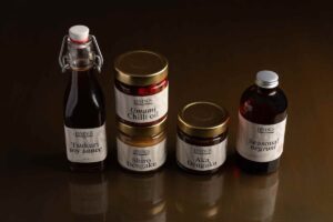 DiningsSW3-Chelsea-Japanesecuisine-FavouritesBoxwithchillioil,soysauce,twomisojars,andabottledNegroni"